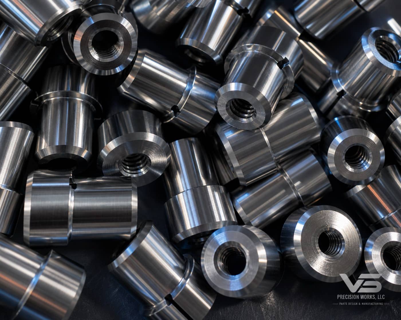 Batch of polished stainless bushings with internal threads